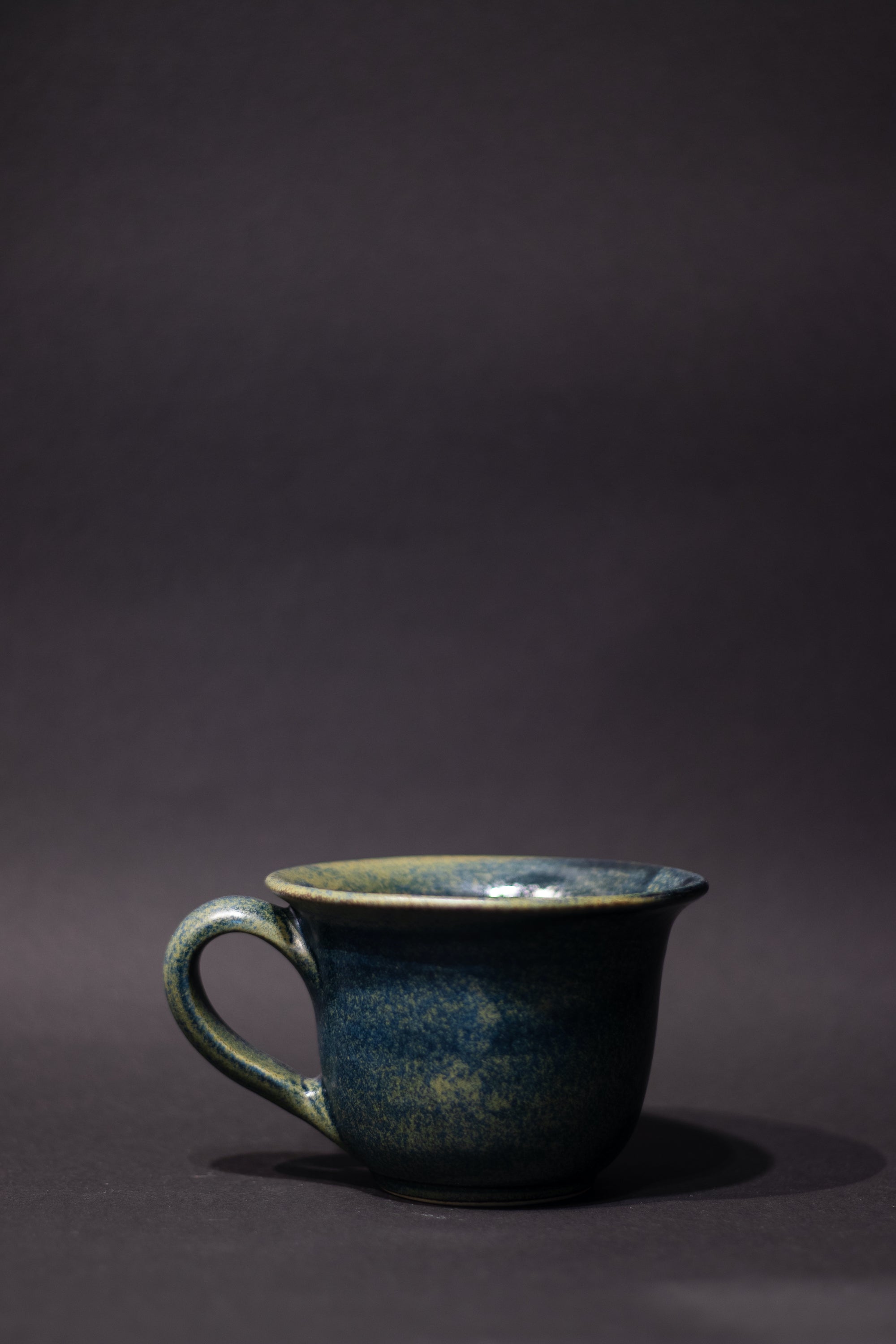 M Handmade ceramic mug with a handle